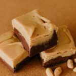 chocolate peanut butter fudge with peanuts around it