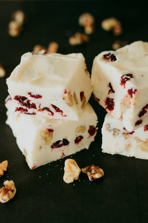 cranberry walnut fudge sliced to see the cranberries and walnuts embedded in it