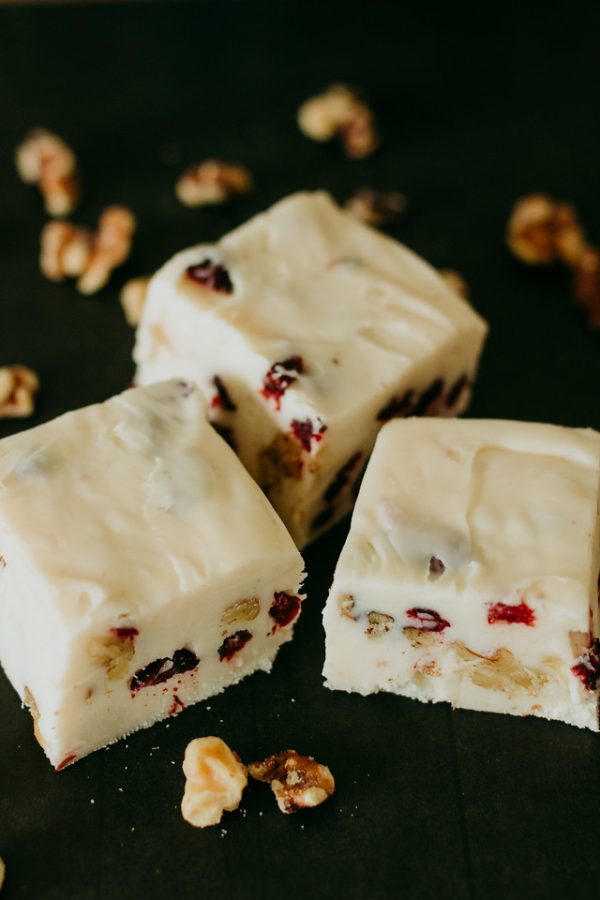 cranberry walnut fudge sliced to see the cranberries and walnuts embedded in it
