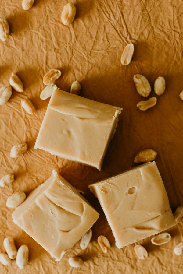 peanut butter fudge surrounded by peanuts
