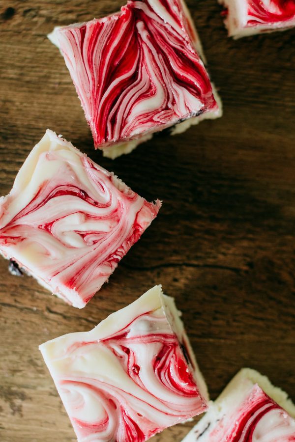 triple berry fudge arranged in an arc around another piece