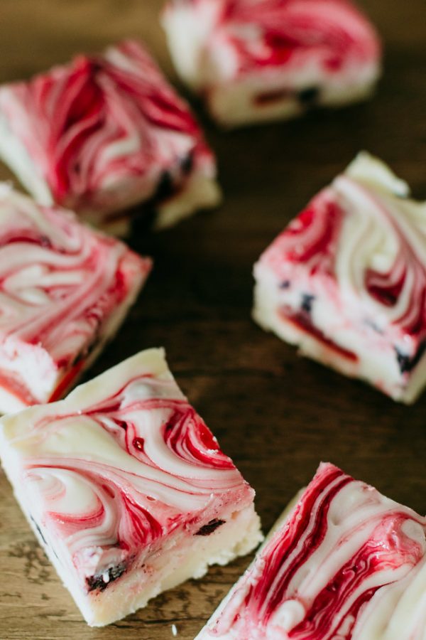 triple berry fudge arranged in an arc around another piece
