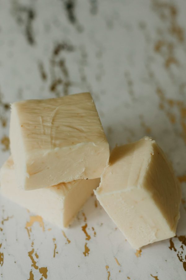 vanilla fudge stacked delicately on a marble counter