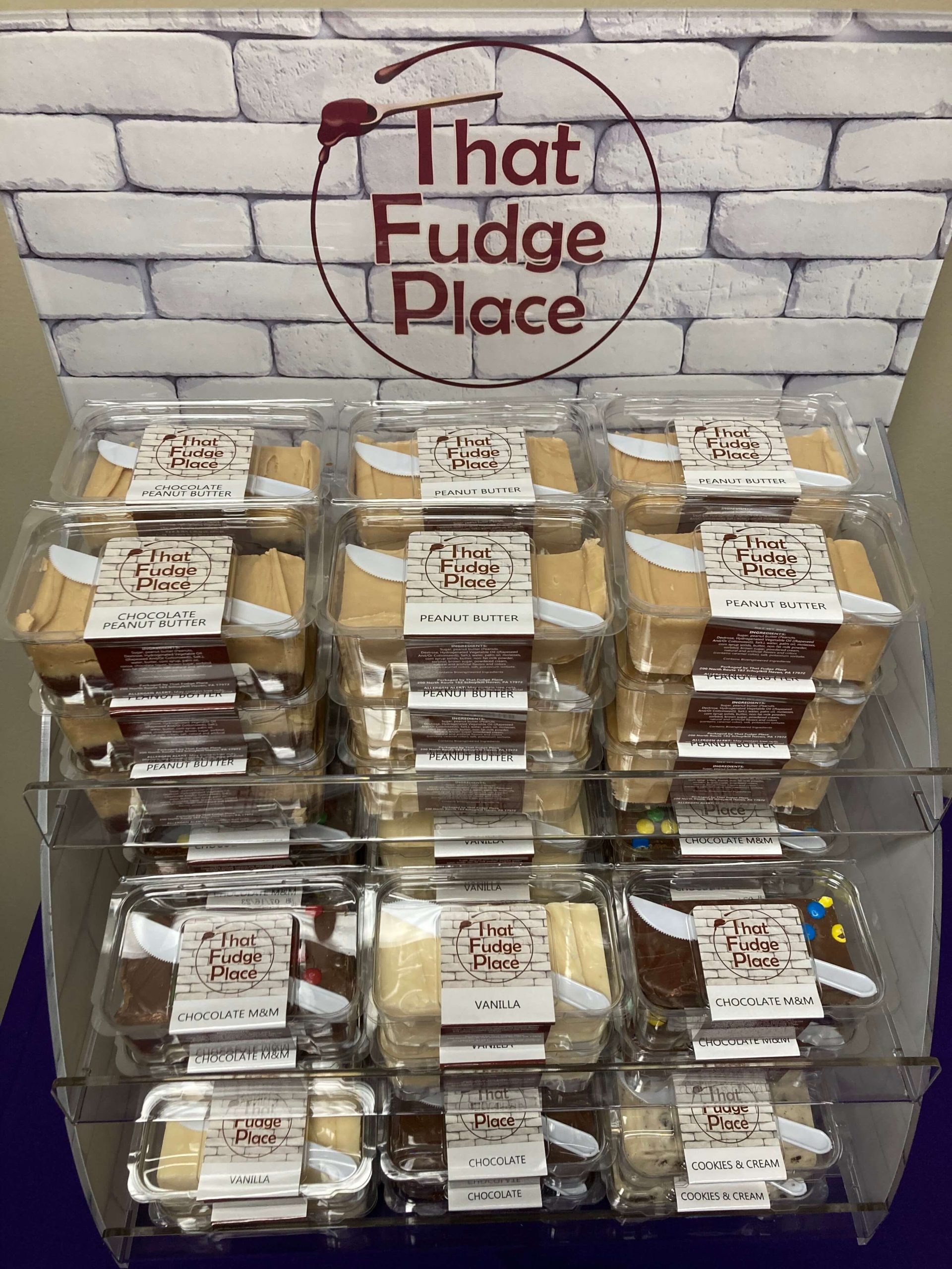 that fudge place display with piles of different flavors of fudge in clams